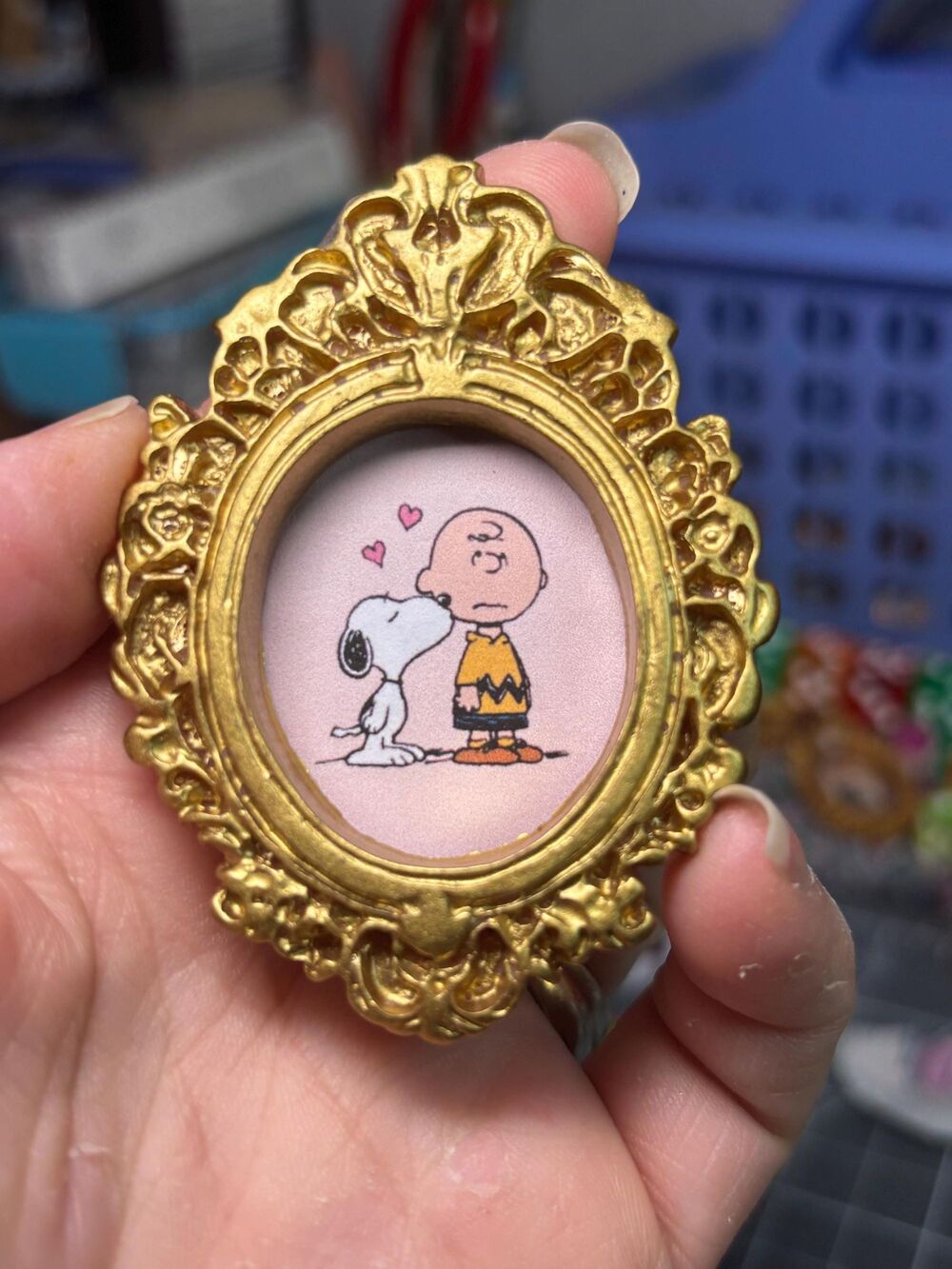 Charlie Brown and Snoopy in a gold framed magnet